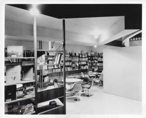 Photograph of Children's World shows an enclosed area filled with children's books and low tables and chairs for patrons during the exhibit.