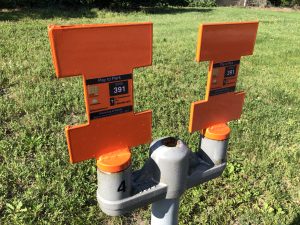 Orange block I parking meters.