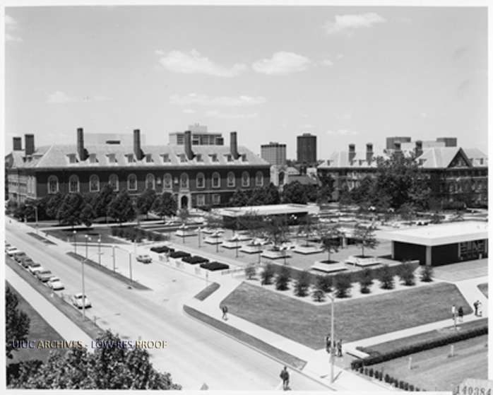 Photograph from the University of Illinois Archives of an aerial view of the entrances and atrium of the Undergraduate Library, University Library and Gregory Hall also visible