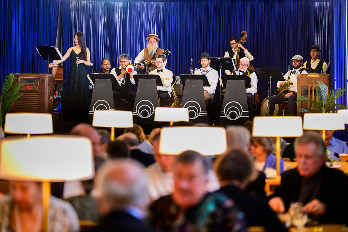 A band performs 1920s era music at the north end of the Reading Room