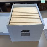 The woodblocks housed upright in their new tux and archival boxes